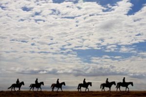 Makgadikgadi Botswana horse riding over plains