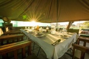 naabi green camp table sunrise