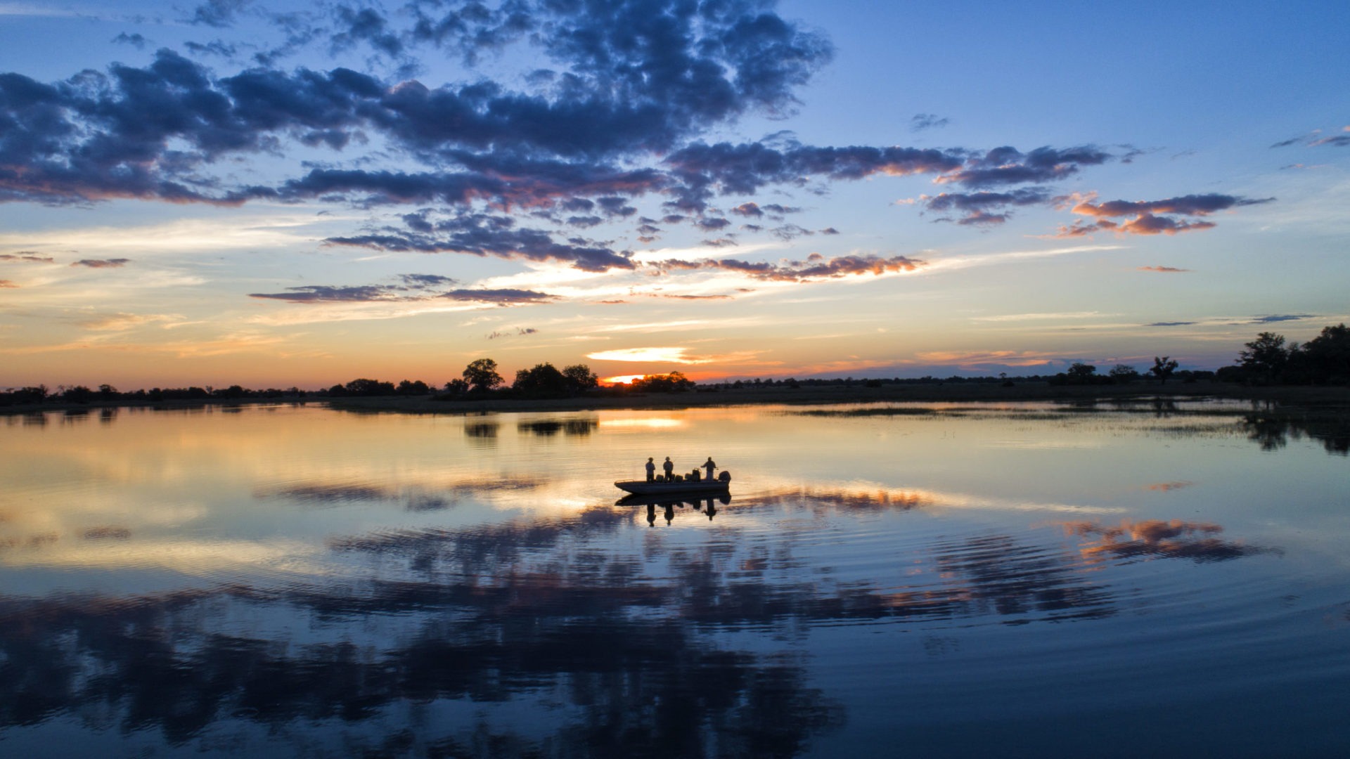 okavango delta botswana mapula lodge boating sunset